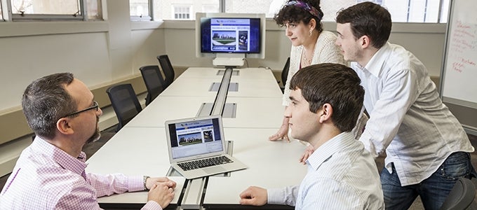 students talking with professor