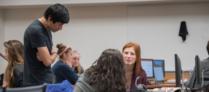 students talking in computer lab