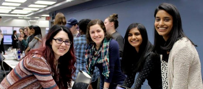female students smiling at camera