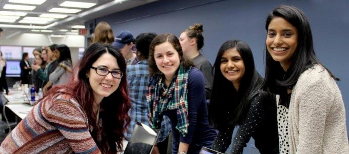 female students smiling at camera
