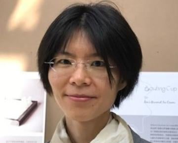Photo of Yu-Ru Lin wearing a white scarf and gray blazer
