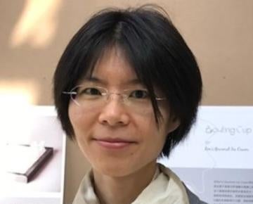 Photo of Yu-Ru Lin wearing a white scarf and gray blazer