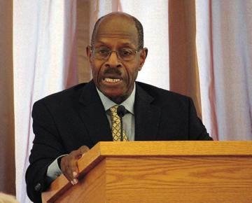 man speaking at a podium