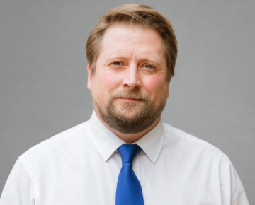 man wearing blue tie and white shirt