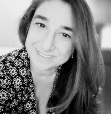 Headshot of SCI alumna Maria Harrington.