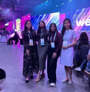 Four SCI students stand together at the Grace Hopper Conference in 2024