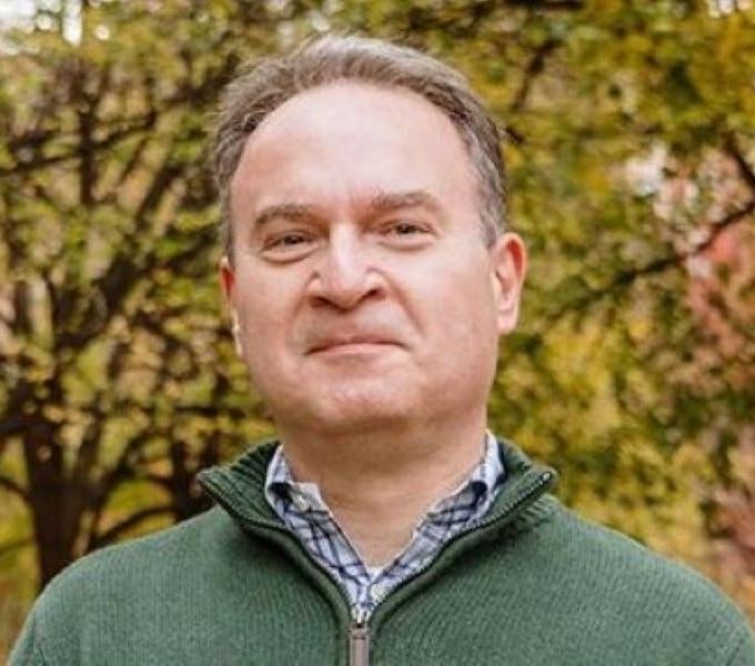 man wearing green sweater outside