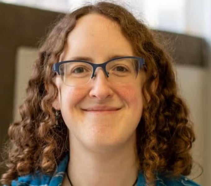 woman with long brown curly hair